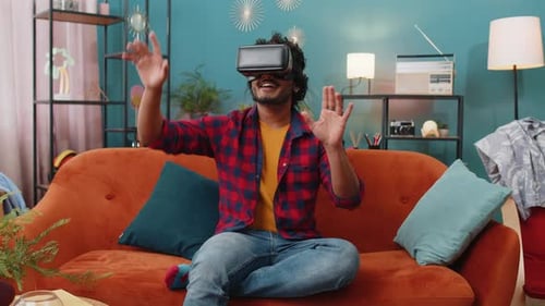 Young Adult Using Virtual Reality Headset at Home