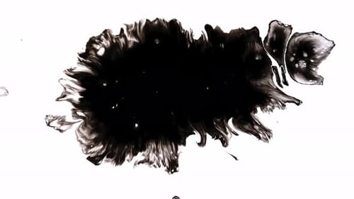Abstract Ink Blot Spreads Across White Surface