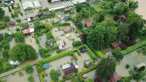 Top view of flooded houses and building with dirty water after heavy rain