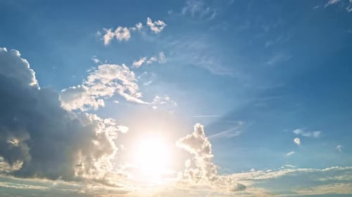 Beautiful Sunset Sky Above Clouds with Dramatic Light Sunset with Sun and Clouds on Blue and Orange