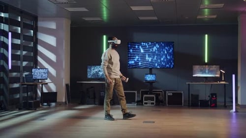 Man Testing a VR Headset and Controllers in a Futuristic Tech Development Lab