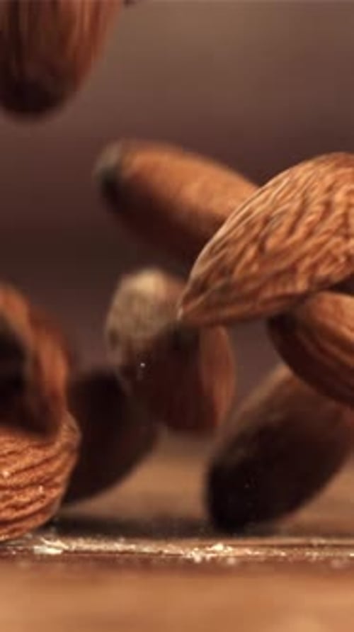 Almonds Fall on the Table Filmed on a Highspeed Camera at 1000 Fps