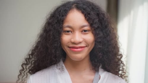 Teen Girl with Curly Hair Smiling Portrait