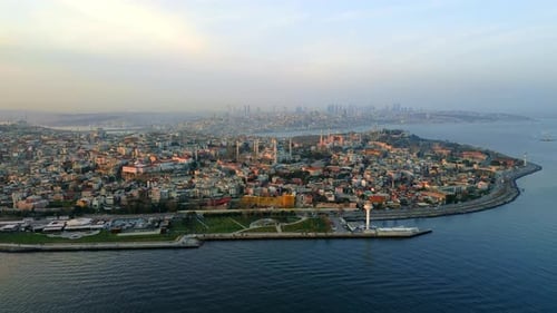 Aerial drone view of Istanbul at sunset, Turkey. Hagia Sophia visible in the distance, Bosporus stra