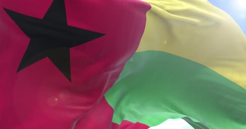 Realistic Waving Guinea-Bissau Flag with Sunny Sky Background