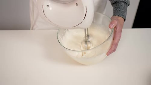 Hands with Electric Mixer Machine and Dough Close Up Boy Making Cake or Cookies in Kitchen