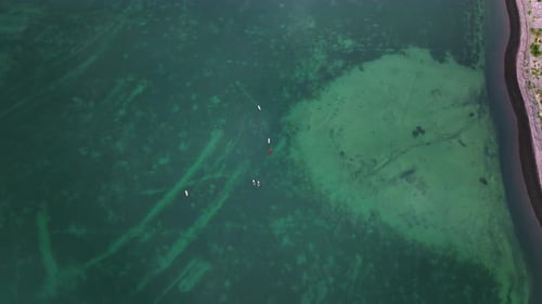 Subsurfers Float in a Bay of Shallow Depth