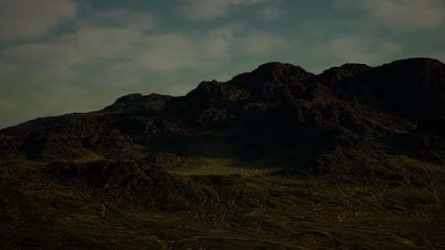 Peaceful Cinematic Mountain Vista with Clouded Silhouettes and Subdued Colors