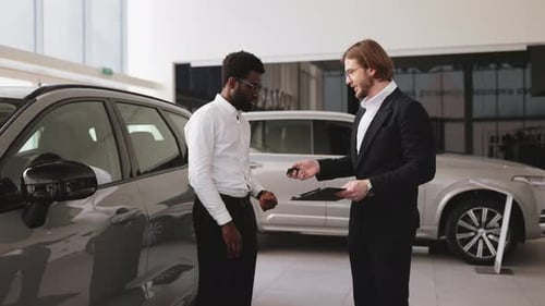 Car Showroom Man Purchasing New Car