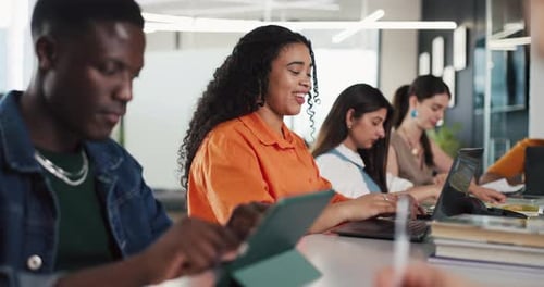 People Working Together At Table On Laptops And Tablets