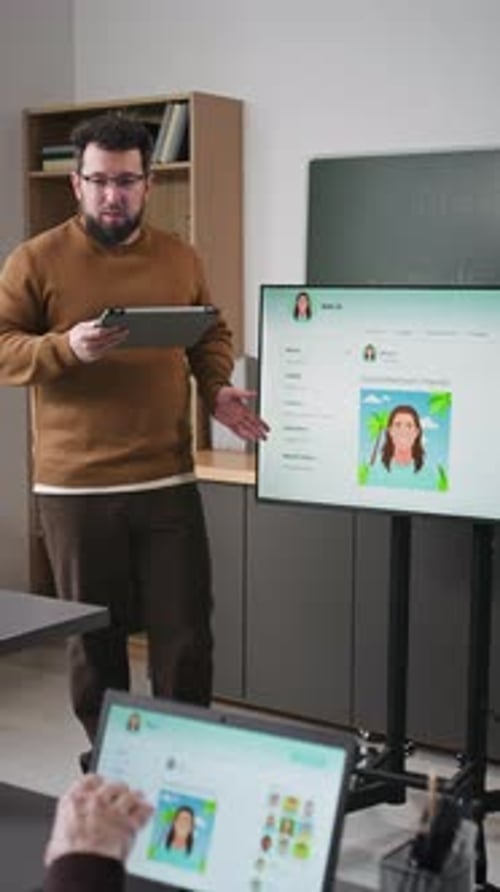 Vertical of Teacher Explaining Social Media in Computer Class