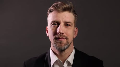 Handsome man with beard on grey background