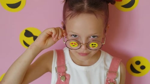 Smiling Young Girl with Emoji Glasses Portrait