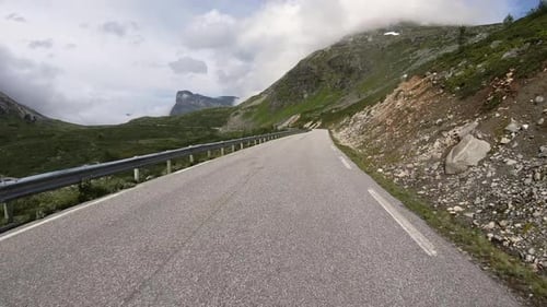 Vehicles Driving On Notable Winding Road Of Trollstigen At Daytime In Norway. - POV