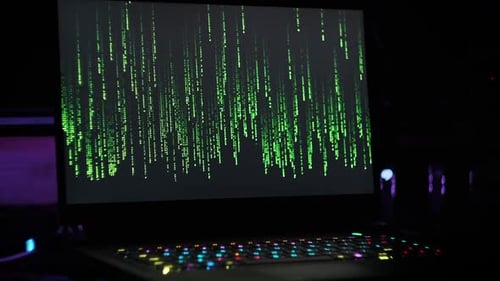 Matrix Code Rain on Laptop Screen in Dark Modern Room