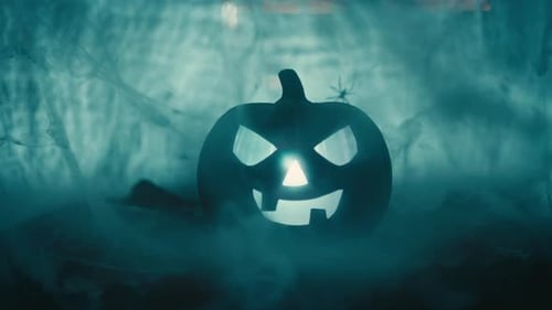 Glowing Halloween Pumpkin with Smoky Atmosphere