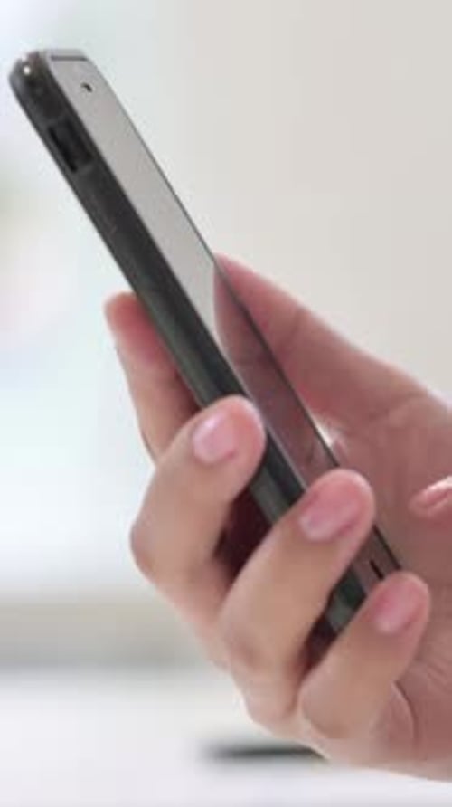 Vertical Close up of African Woman Typing on Smartphone