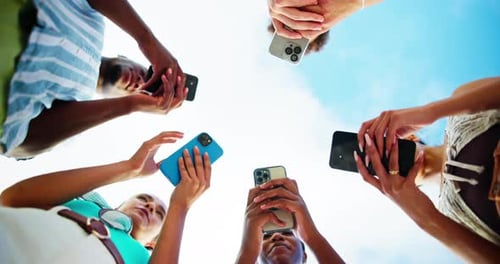 Outdoor, group and people with hands for smartphone, typing and connection for social media