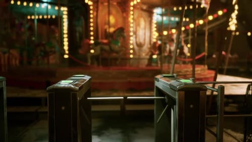 Empty Amusement Park Illuminated with Lights at Night Full of Quiet