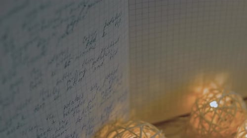 Open Notebook with Handwritten Recipe and String Lights