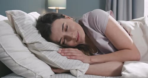 Portrait of Happy Young Caucasian Woman Smiling and Laughing to Camera Pretty Female Lying in Bed