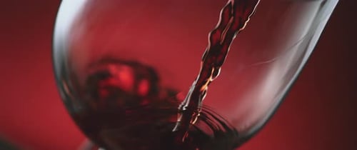 Red Wine Pouring into Glass