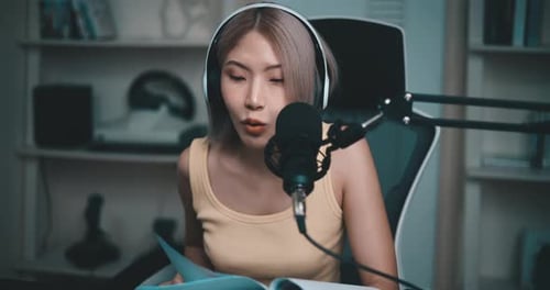Young Woman Recording Audio in Home Studio