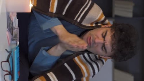 Man Counting Money and Rubbing Hands Indoors