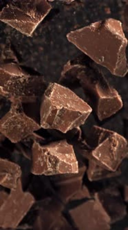 Pieces of Chocolate Fly Up and Fall Down Filmed on a Highspeed Camera at 1000 Fps