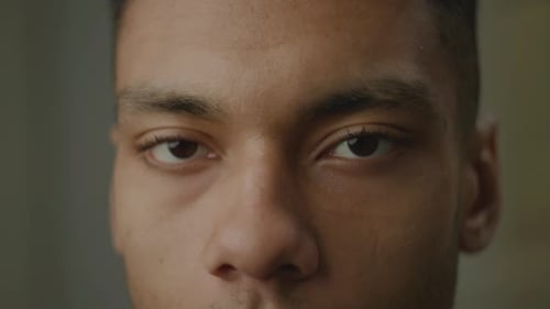 Black Man Eyes Opening Close Up African American Face Smiling Looking at Camera