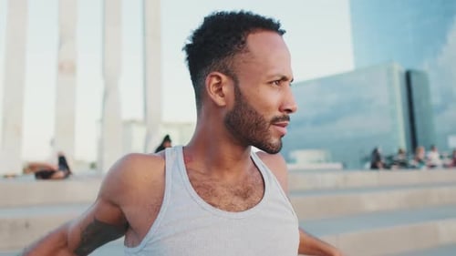 Man Stretching Arms in an Urban Environment