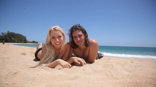 Portrait of Couple Laying in Sand at Tropical Beach 20-25