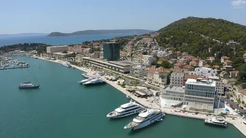 Luxury Yachts And Boats Dock At Marina On A Sunny Day In Split, Croatia. - aerial