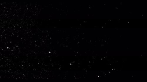 Fragment Collection: A side angle view of a big glass shattering and falling down over a black backg