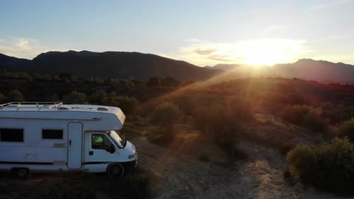 Caravan on Roadside at Sunset. Aerial View.