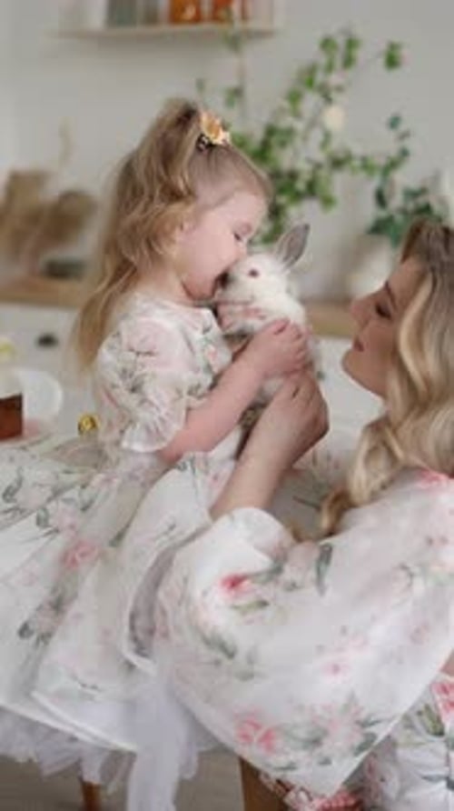 Child and Woman with Rabbit in a Home