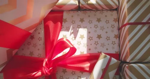 Brightly Wrapped Holiday Gift Boxes with Bows