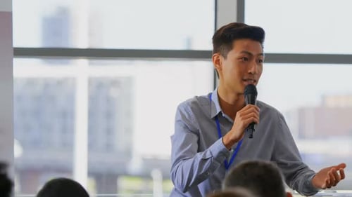 Young Adult Speaking at Corporate Event