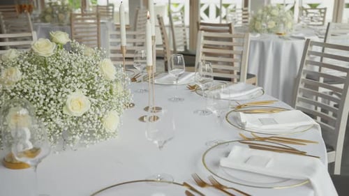 Elegant Wedding Reception Table with White and Gold Decor