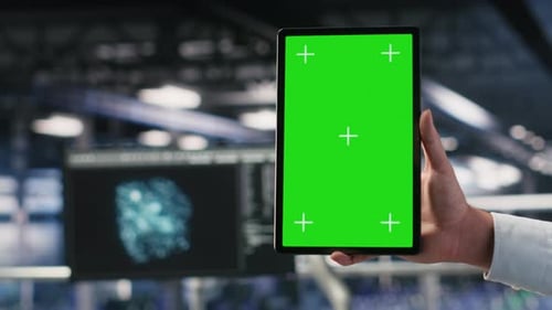 Close Up of Data Center Admin Using Mockup Tablet to Update Software