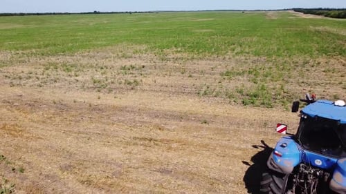 Blue Tractor O.A. Planting Canola On No Till Field