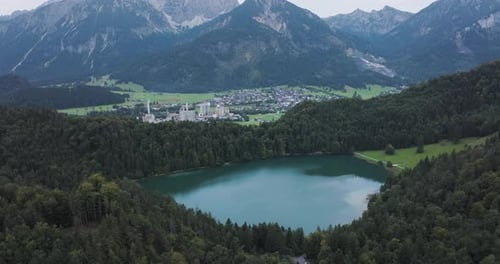 Aerial view of lake and town with mountains, Germany.