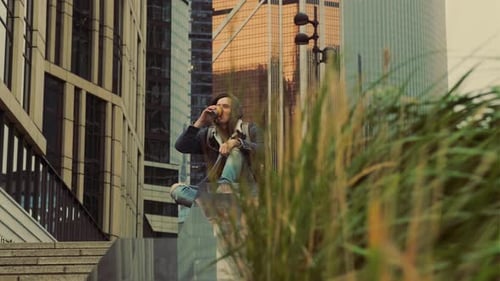 Young Adult Drinking Beverage in Urban Setting
