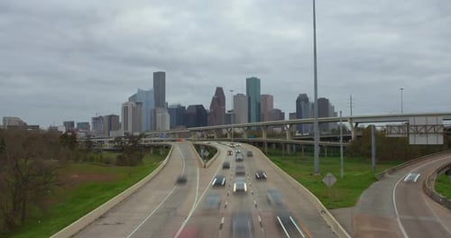 Timelapse of cars on I-45 North freeway with downtown in the background in Houston, Texas