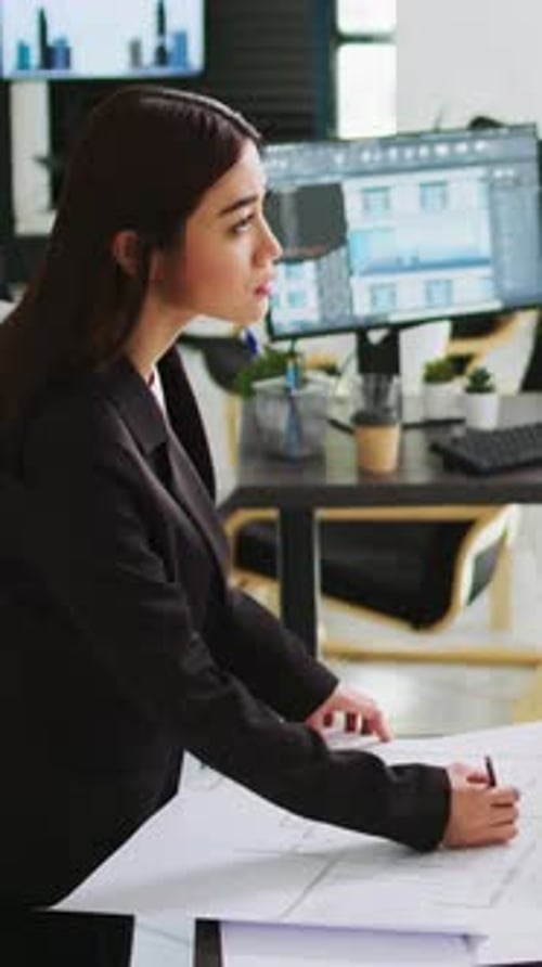 Vertical Video Architects Team Studying 3d Printed Building Model in Office