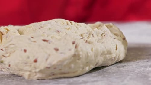 Hands in the shot make bread