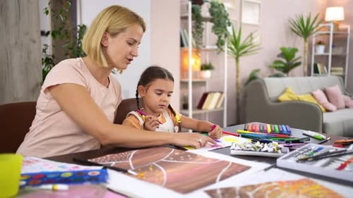Mother and Child Drawing Together at Home