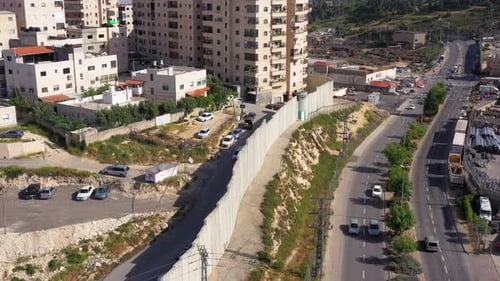 Security wall with Israeli idf watch tower Close to Shuafat Refugee Camp- Aerial