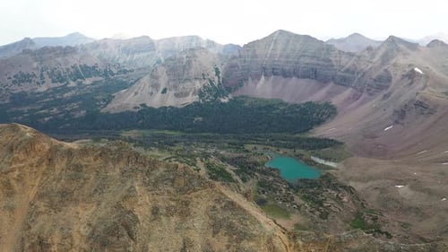 Aerial View of Amethyst Lake in Scenic Valley Under Uinta Mountains Range, Utah USA. Drone Shot