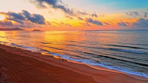 Aerial Top view of a transparent blue sea with beautiful waves at sunny day in summer. air of ocean